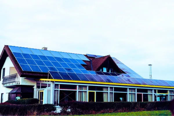 Photovoltaic industry innovation displayed on a home’s solar panel-covered rooftop.