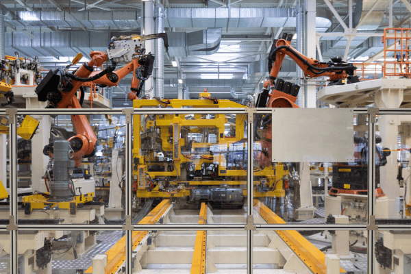 Robotic equipment on an automotive production line, showcasing the integration of power battery solutions in manufacturing.